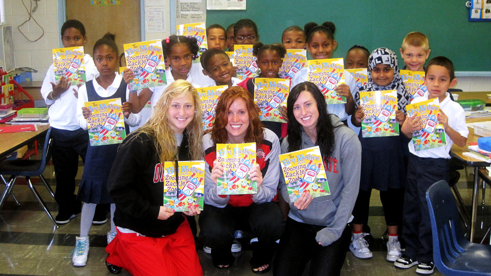 school children and athletes posing with books